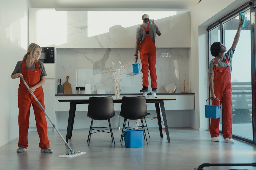 Professional team performing detailed airbnb cleaning between guest stays